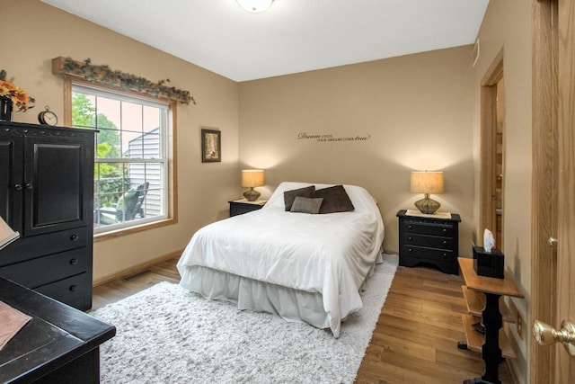 15229 Cobalt St NW, Ramsey, MN 55303 - bedroom with wood finished floors and baseboards