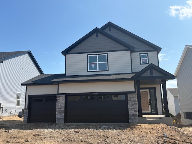 10300 187th Ave NW, Elk River, MN 55330 - craftsman-style home with driveway and stone siding