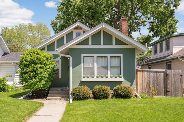 4027 24th Ave S, Minneapolis, MN 55406 - view of front of home with a chimney and stucco siding
