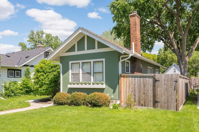4027 24th Ave S, Minneapolis, MN 55406 - view of front of house featuring stucco siding and a chimney