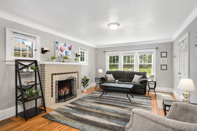 4027 24th Ave S, Minneapolis, MN 55406 - living room with baseboards, ornamental molding, wood finished floors, a fireplace, and a textured ceiling