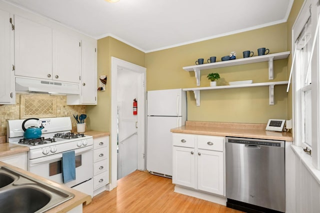 4027 24th Ave S, Minneapolis, MN 55406 - kitchen with white appliances, under cabinet range hood, decorative backsplash, white cabinets, and ornamental molding