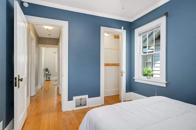 4027 24th Ave S, Minneapolis, MN 55406 - bedroom featuring wood finished floors, baseboards, and ornamental molding