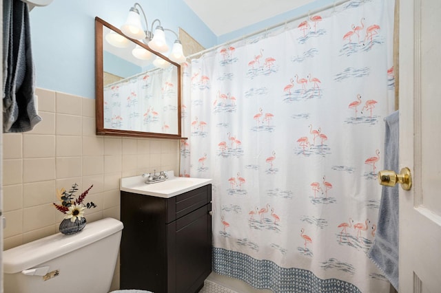 4027 24th Ave S, Minneapolis, MN 55406 - bathroom with tile walls, vanity, toilet, curtained shower, and tasteful backsplash