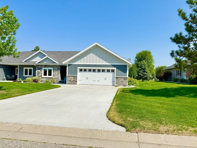 910 Lake Forest Cir, Detroit Lakes, MN 56501 - craftsman inspired home featuring stone siding, an attached garage, board and batten siding, and a front yard