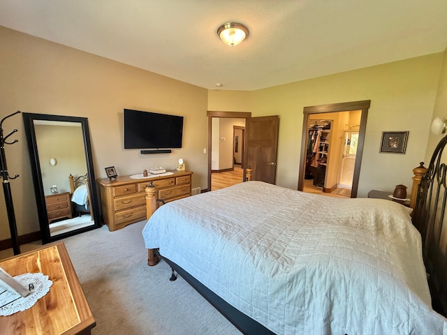 910 Lake Forest Cir, Detroit Lakes, MN 56501 - bedroom featuring light colored carpet and a spacious closet