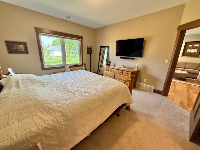 910 Lake Forest Cir, Detroit Lakes, MN 56501 - bedroom featuring baseboards and light colored carpet