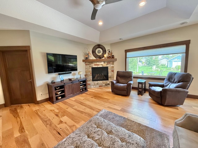 910 Lake Forest Cir, Detroit Lakes, MN 56501 - living area featuring light wood-style flooring, baseboards, a fireplace, and a ceiling fan