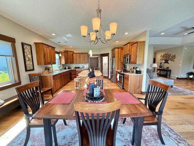 910 Lake Forest Cir, Detroit Lakes, MN 56501 - dining room with light wood-type flooring, plenty of natural light, a chandelier, recessed lighting, and baseboards