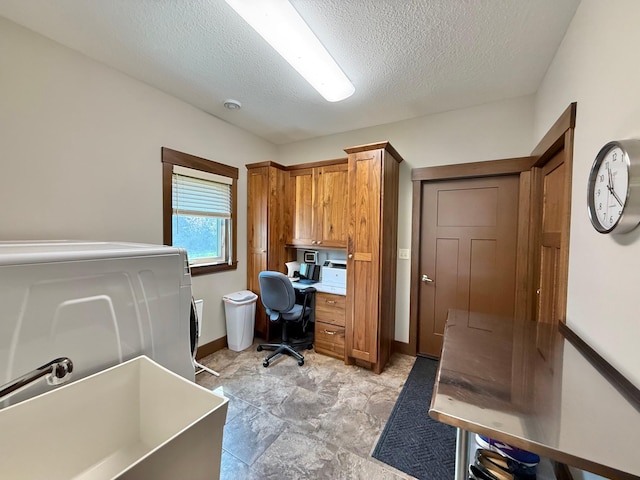 910 Lake Forest Cir, Detroit Lakes, MN 56501 - office space with a sink, washer / dryer, a textured ceiling, and baseboards