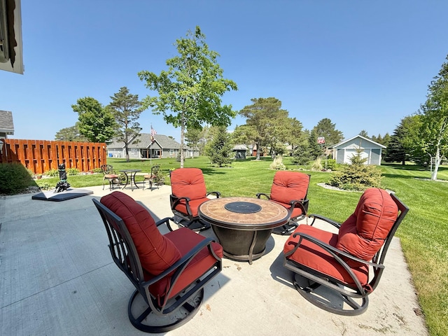 910 Lake Forest Cir, Detroit Lakes, MN 56501 - view of patio / terrace featuring a fire pit and an outbuilding