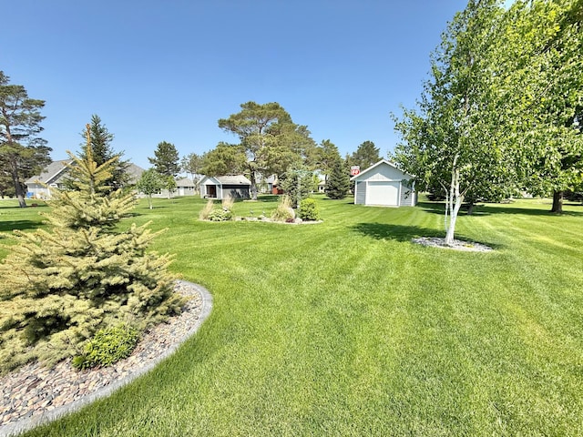 910 Lake Forest Cir, Detroit Lakes, MN 56501 - view of grassy yard with a garage