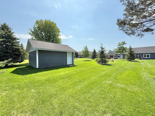 910 Lake Forest Cir, Detroit Lakes, MN 56501 - view of grassy yard featuring an outdoor structure