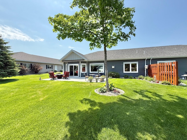 910 Lake Forest Cir, Detroit Lakes, MN 56501 - rear view of property with a patio area and a lawn