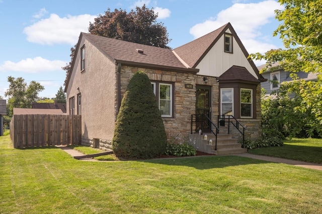 3638 Van Buren St NE, Minneapolis, MN 55418 - english style home with stone siding, board and batten siding, and roof with shingles
