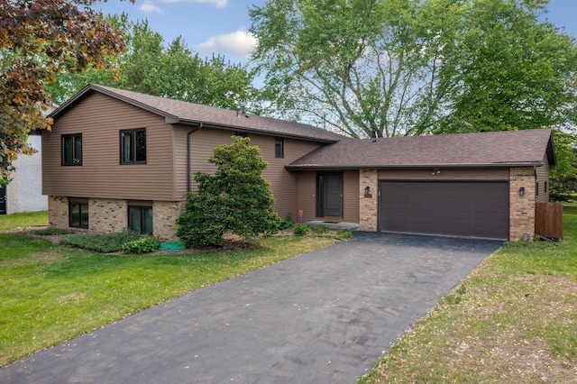 4781 Zealand Ave N, New Hope, MN 55428 - split level home featuring brick siding, driveway, an attached garage, a front yard, and a shingled roof