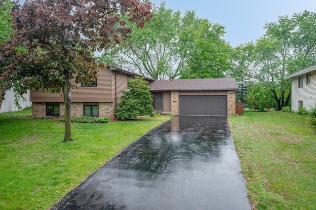 4781 Zealand Ave N, New Hope, MN 55428 - tri-level home with brick siding, an attached garage, driveway, and a front lawn