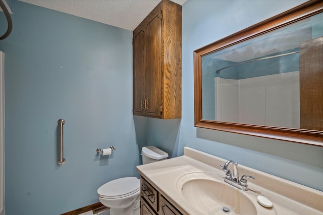 4781 Zealand Ave N, New Hope, MN 55428 - bathroom with vanity, a textured ceiling, and a shower