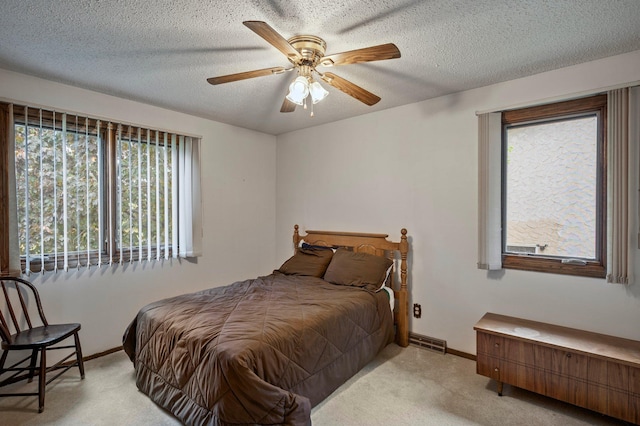 4781 Zealand Ave N, New Hope, MN 55428 - bedroom with light colored carpet, ceiling fan, and a textured ceiling