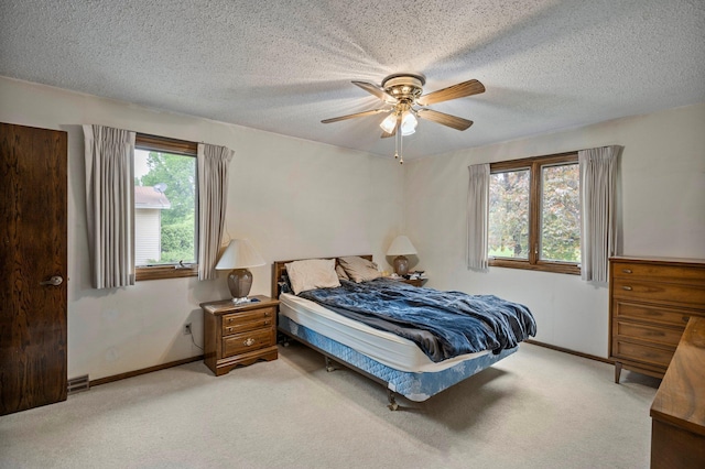 4781 Zealand Ave N, New Hope, MN 55428 - bedroom featuring light colored carpet, a textured ceiling, and ceiling fan