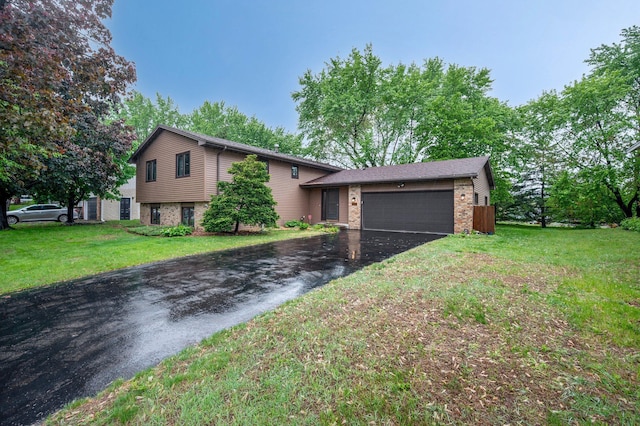 4781 Zealand Ave N, New Hope, MN 55428 - split level home with asphalt driveway, brick siding, a garage, and a front yard