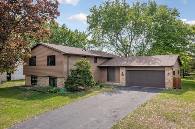 4781 Zealand Ave N, New Hope, MN 55428 - tri-level home with asphalt driveway, an attached garage, a front lawn, and brick siding