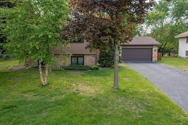 4781 Zealand Ave N, New Hope, MN 55428 - view of front of home featuring brick siding, asphalt driveway, a front lawn, and an attached garage