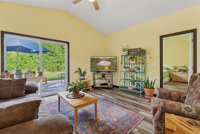 134 9th Ave NE, Isanti, MN 55040 - living room with vaulted ceiling, a ceiling fan, and wood finished floors
