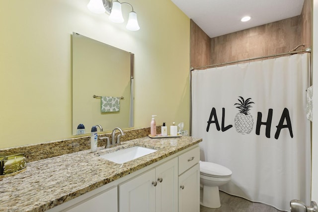 134 9th Ave NE, Isanti, MN 55040 - bathroom with toilet, vanity, and a shower with curtain