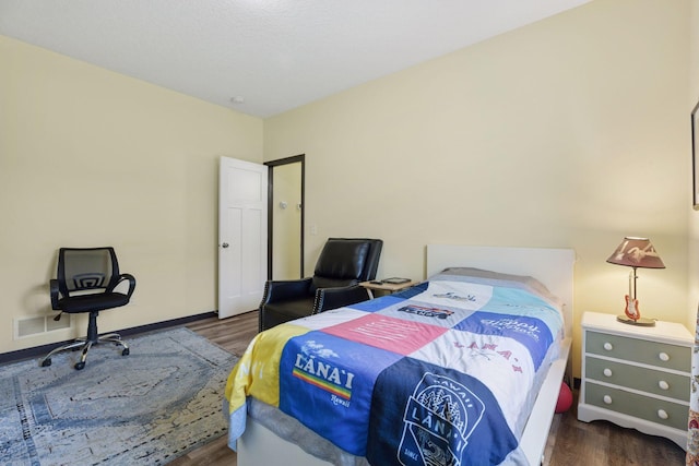 134 9th Ave NE, Isanti, MN 55040 - bedroom featuring wood finished floors and baseboards