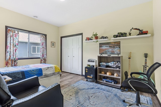 134 9th Ave NE, Isanti, MN 55040 - bedroom featuring wood finished floors and a closet