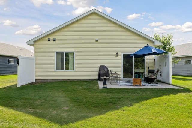 134 9th Ave NE, Isanti, MN 55040 - back of property with a yard and a patio area