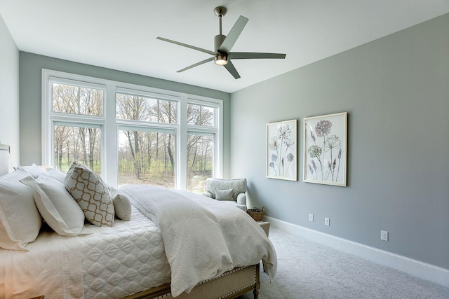 677 Shawnee Woods Rd, Medina, MN 55340 - carpeted bedroom with baseboards and ceiling fan