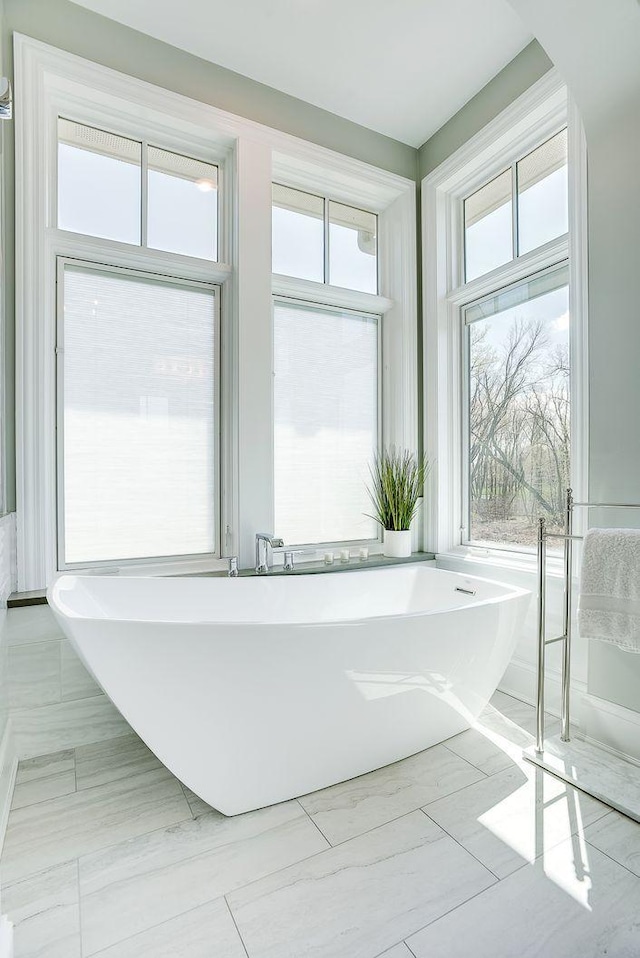 677 Shawnee Woods Rd, Medina, MN 55340 - full bath featuring a freestanding bath and healthy amount of natural light