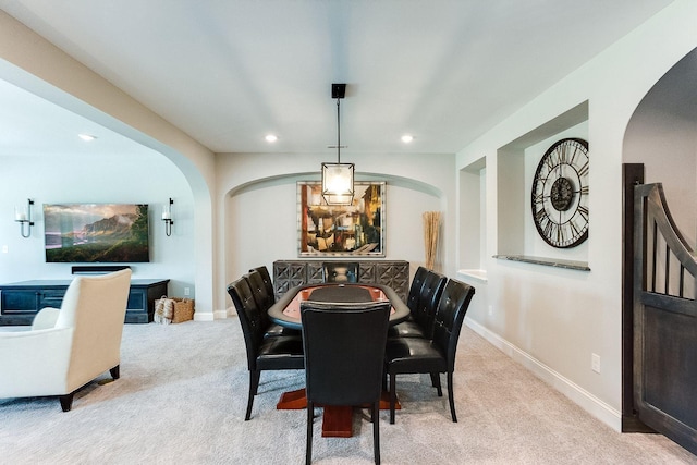 677 Shawnee Woods Rd, Medina, MN 55340 - dining area featuring arched walkways, light colored carpet, recessed lighting, and baseboards