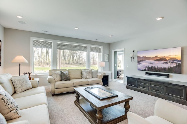 677 Shawnee Woods Rd, Medina, MN 55340 - living area with light colored carpet, plenty of natural light, and recessed lighting