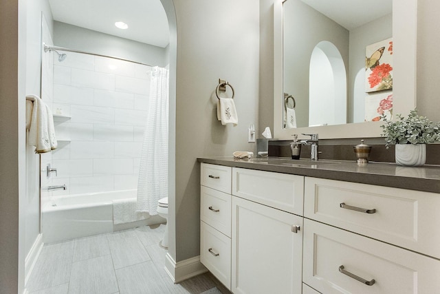 677 Shawnee Woods Rd, Medina, MN 55340 - bathroom featuring toilet, vanity, shower / tub combo, and baseboards