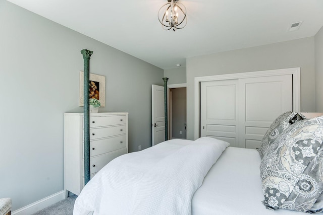677 Shawnee Woods Rd, Medina, MN 55340 - carpeted bedroom with baseboards and a closet