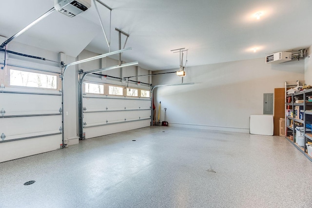 677 Shawnee Woods Rd, Medina, MN 55340 - garage with electric panel, a garage door opener, and baseboards