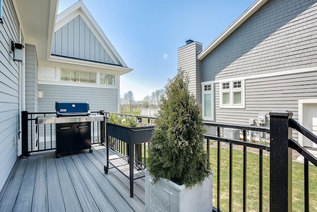 677 Shawnee Woods Rd, Medina, MN 55340 - wooden deck featuring a lawn and grilling area