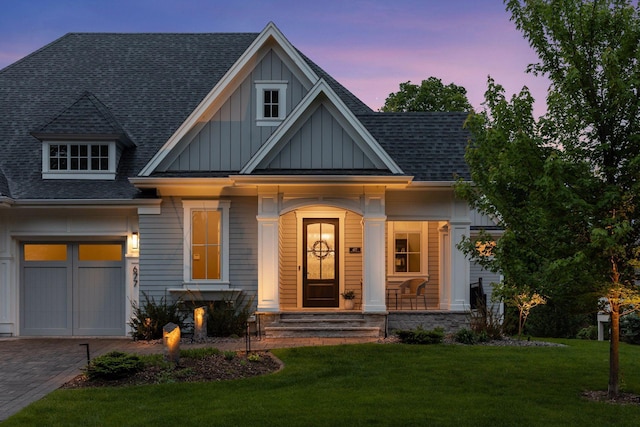 677 Shawnee Woods Rd, Medina, MN 55340 - craftsman inspired home featuring board and batten siding, roof with shingles, a front lawn, and covered porch