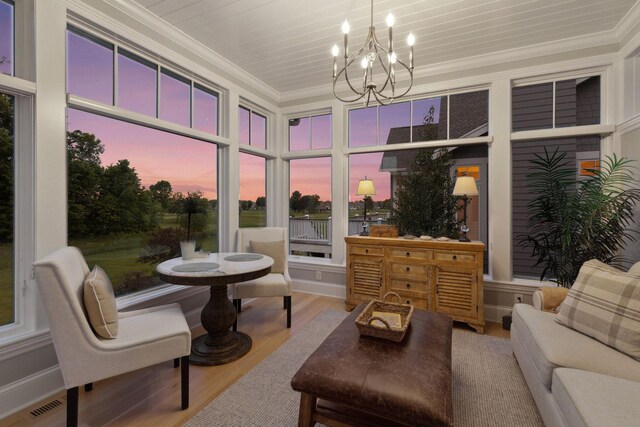 677 Shawnee Woods Rd, Medina, MN 55340 - sunroom / solarium featuring a chandelier and healthy amount of natural light