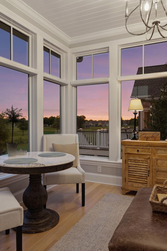 677 Shawnee Woods Rd, Medina, MN 55340 - sunroom with a chandelier and plenty of natural light