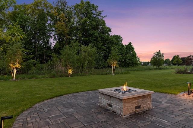 677 Shawnee Woods Rd, Medina, MN 55340 - patio terrace at dusk featuring a fire pit, a patio, and a yard