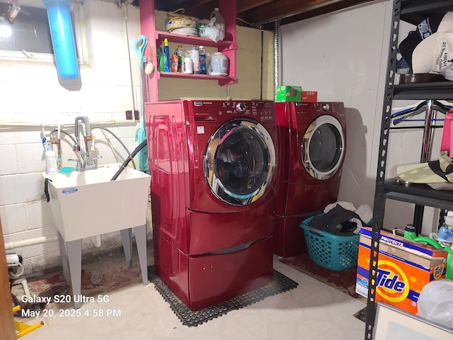 7036 Regent Ave N, Brooklyn Center, MN 55429 - laundry area with washer and dryer and concrete block wall