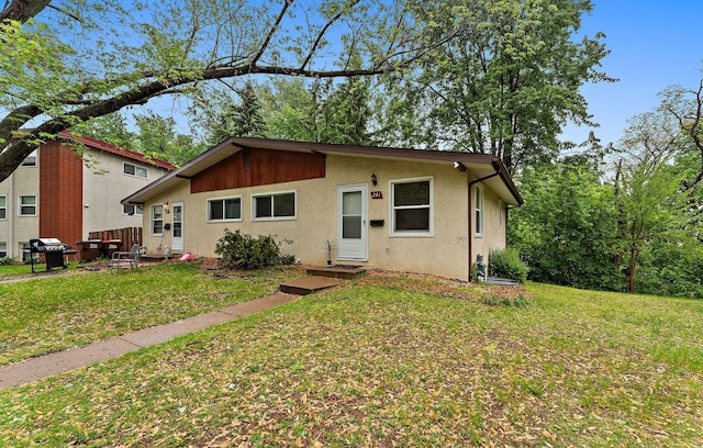 239 Buron Ln S, Saint Paul, MN 55075 - bungalow-style house featuring a front lawn and stucco siding