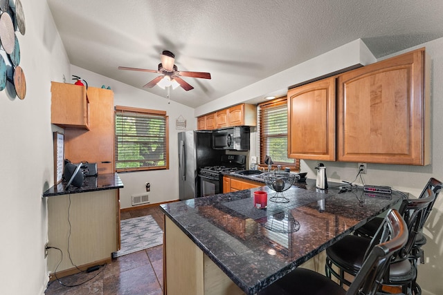 239 Buron Ln S, Saint Paul, MN 55075 - kitchen featuring black appliances, ceiling fan, lofted ceiling, a sink, and dark stone countertops