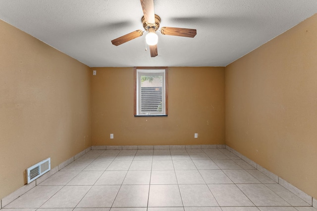 239 Buron Ln S, Saint Paul, MN 55075 - unfurnished room featuring a ceiling fan, a textured ceiling, light tile patterned floors, and baseboards