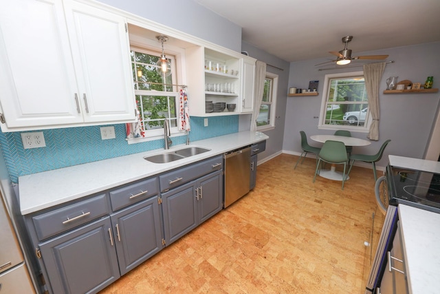 1423 Cedar St, Alexandria, MN 56308 - kitchen with stainless steel appliances, a sink, open shelves, white cabinetry, and light countertops