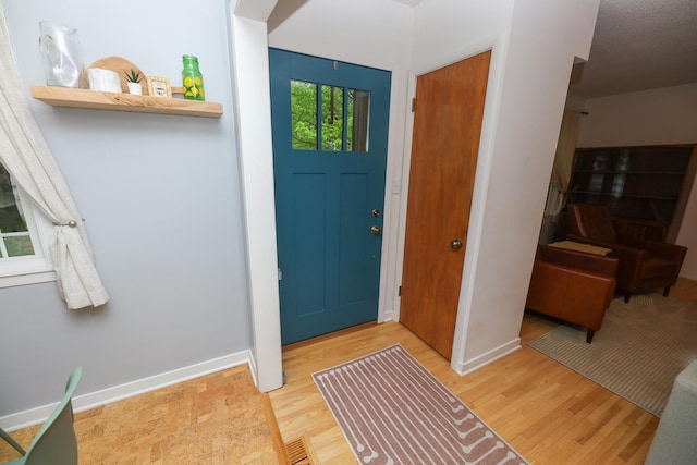 1423 Cedar St, Alexandria, MN 56308 - entryway with wood finished floors and baseboards